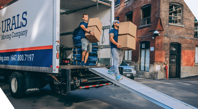 Urals Moving Company team with white truck moving packages in uniform mobile version